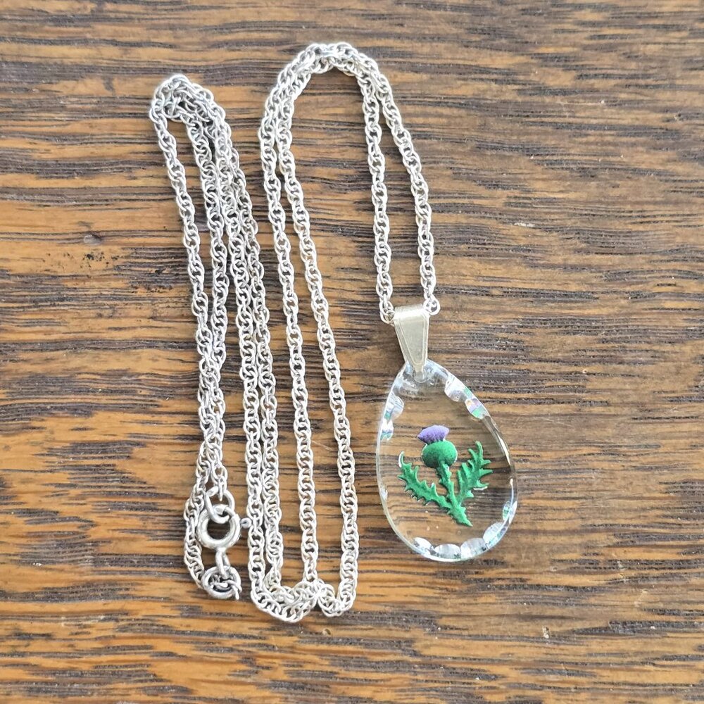 Glass thistle pendant, sterling silver setting & chain.